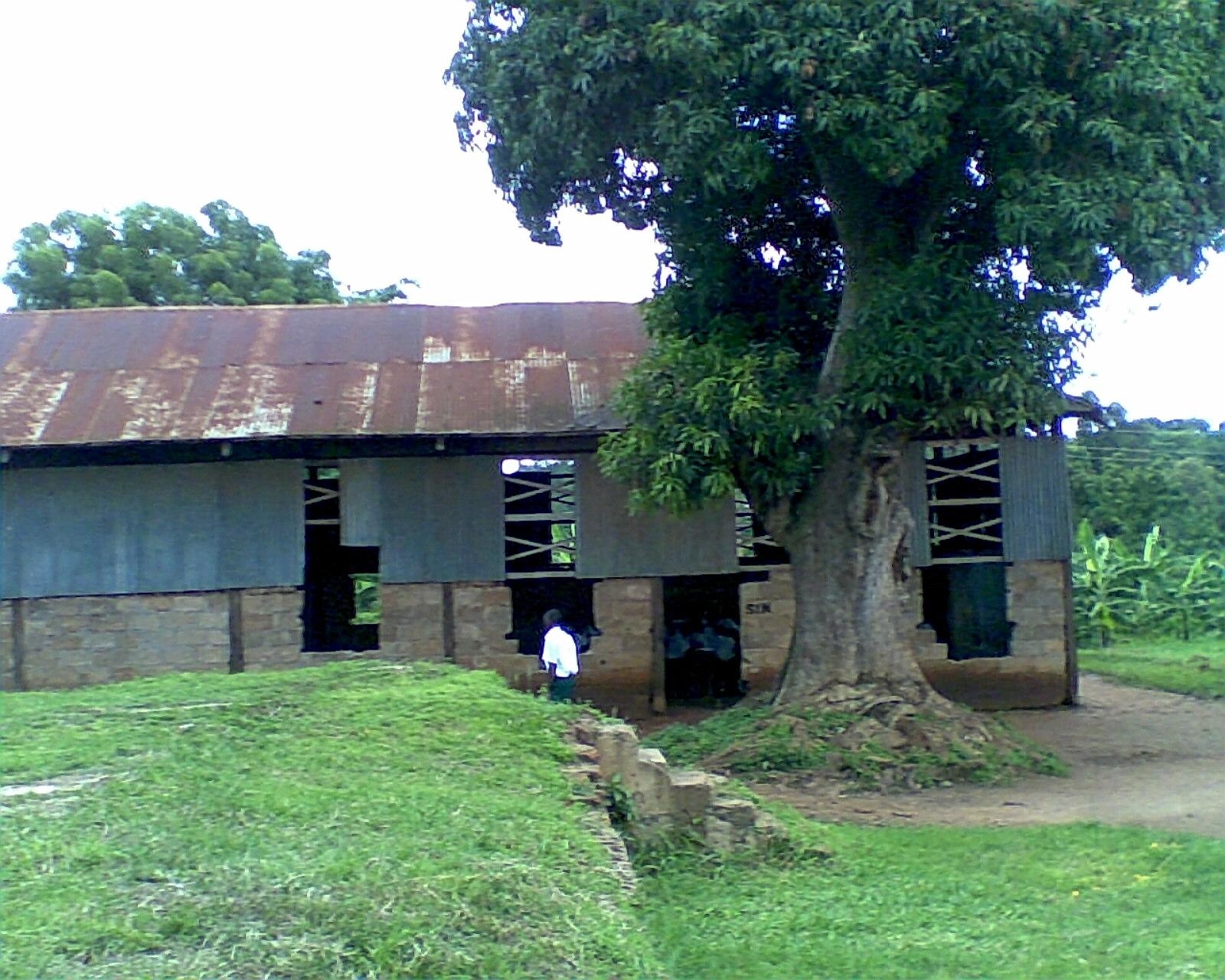 One school Block with two classes. Notice that students are inside studing. Doors and windows are urgently needed!